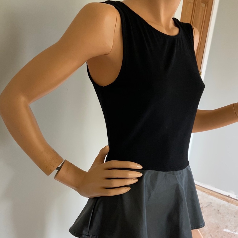 Stretch knit top with leather look peplum